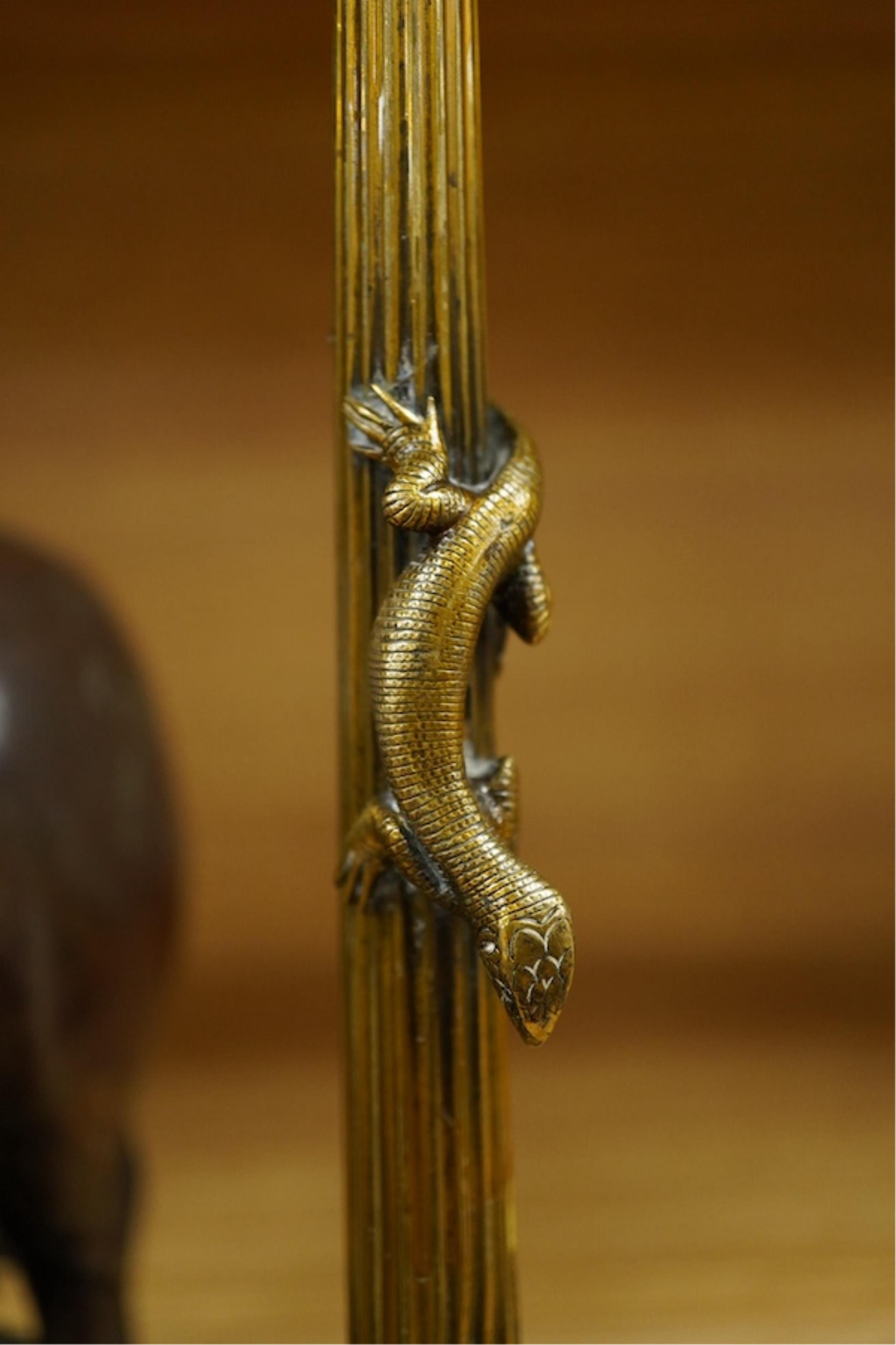 A patinated copper study, 'American Brahman', inscribed EtC, together with a pair of 19th century ormolu candlesticks, largest 30cm high. Condition - fair, bull missing one horn